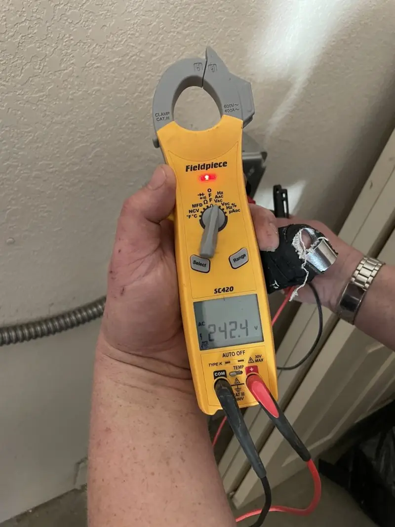 Voltage testing with clamp meter during Ceiling Fan Installation in Seat Pleasant